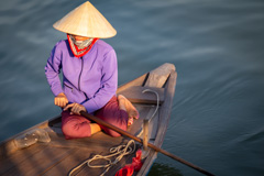 Woman on a boat in Hoi An